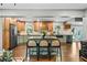 Spacious kitchen with a center island, wood cabinets, stainless steel appliances, and hardwood floors at 285 Jade Cove Dr, Roswell, GA 30075