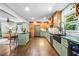 Large kitchen with hardwood floors, wooden cabinetry, stainless steel appliances, and a center island at 285 Jade Cove Dr, Roswell, GA 30075