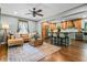 Cozy living area with hardwood floors, modern furniture, and an adjacent kitchen at 285 Jade Cove Dr, Roswell, GA 30075