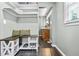 Functional mud room area with bench, shelves, and access to a washroom at 285 Jade Cove Dr, Roswell, GA 30075