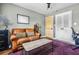 Office room with a leather couch, a stylish rug, and an adjustable desk chair at 285 Jade Cove Dr, Roswell, GA 30075