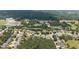 Overhead view of suburban neighborhood featuring lush greenery, community pool, and traditional two-story homes at 4345 Idlewood Dr, Cumming, GA 30040