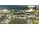 Overhead view of suburban neighborhood featuring lush greenery, community pool, and traditional two-story homes at 4345 Idlewood Dr, Cumming, GA 30040