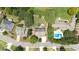 Overhead view of the property, showcasing its location with neighboring homes, spacious yards, and mature trees at 4345 Idlewood Dr, Cumming, GA 30040