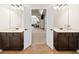 Dual vanity bathroom with a connecting hallway and plenty of natural light, offering space and convenience at 4345 Idlewood Dr, Cumming, GA 30040