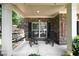 Inviting front porch with comfortable seating, including rocking chairs and a swing, perfect for relaxing outdoors at 4345 Idlewood Dr, Cumming, GA 30040