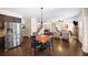 Spacious eat-in kitchen with stainless steel refrigerator and easy access to the living room at 4345 Idlewood Dr, Cumming, GA 30040