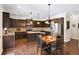 Modern kitchen featuring dark cabinetry, stainless steel appliances, and granite countertops at 4345 Idlewood Dr, Cumming, GA 30040