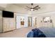 Bright main bedroom with neutral decor and walk-through to ensuite bath and seating area at 4345 Idlewood Dr, Cumming, GA 30040