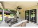 A covered patio includes outdoor seating and access to the backyard through double glass doors at 4345 Idlewood Dr, Cumming, GA 30040