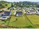 Aerial view of luxury home with inviting pool, professionally landscaped yard, and ample land in a desirable neighborhood at 4720 Down Setting Rd, Cumming, GA 30028