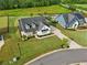 Aerial view of a home with manicured lawn, mature trees and a swimming pool in the backyard at 4720 Down Setting Rd, Cumming, GA 30028