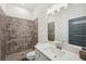 Bathroom featuring a large shower with gray tile and a white vanity with a large mirror at 4720 Down Setting Rd, Cumming, GA 30028