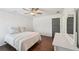 Comfortable bedroom featuring a ceiling fan, wood-look floors and neutral walls and trim at 4720 Down Setting Rd, Cumming, GA 30028