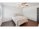 Cozy bedroom with hardwood floors, a ceiling fan and a window with plantation shutters at 4720 Down Setting Rd, Cumming, GA 30028