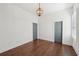 Bright bedroom with hardwood floors and two large doors, one leading to a walk-in closet at 4720 Down Setting Rd, Cumming, GA 30028