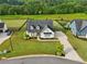Charming white farmhouse with manicured lawn, black fence, and inviting curb appeal at 4720 Down Setting Rd, Cumming, GA 30028