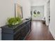Inviting foyer features hardwood floors and dark wood accents with lots of natural light at 4720 Down Setting Rd, Cumming, GA 30028