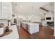 Open kitchen and living area features a large island, stainless appliances, and modern finishes at 4720 Down Setting Rd, Cumming, GA 30028