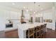A modern kitchen with a spacious island and stainless-steel appliances at 4720 Down Setting Rd, Cumming, GA 30028