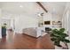 Bright living room with hardwood floors, fireplace, and built-in shelves, perfect for cozy evenings at 4720 Down Setting Rd, Cumming, GA 30028