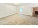 Large bedroom featuring neutral walls, carpeted floors, and a brick fireplace at 5968 Hilltop Dr, Douglasville, GA 30135