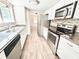 Modern kitchen featuring stainless steel appliances, granite countertops, and mosaic backsplash at 5968 Hilltop Dr, Douglasville, GA 30135