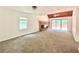 Spacious living room with vaulted ceiling, brick fireplace, and sliding glass doors to the deck at 5968 Hilltop Dr, Douglasville, GA 30135