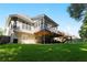 Exterior of this 2-story home featuring the deck, patio, and backyard at 1360 Mount Mickinley Dr, Grayson, GA 30017