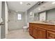 Bathroom featuring a tiled glass shower, wood vanity with granite counters, and ceramic tiled flooring at 1360 Mount Mickinley Dr, Grayson, GA 30017