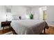 Cozy bedroom featuring hardwood floors, a plush queen-sized bed, and stylish mid-century modern bedside tables at 1360 Mount Mickinley Dr, Grayson, GA 30017