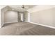 Spacious bedroom featuring neutral paint, plush carpeting, and a ceiling fan at 1360 Mount Mickinley Dr, Grayson, GA 30017