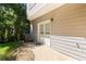 Exterior door on side of the house with small yard and exterior A/C unit at 1360 Mount Mickinley Dr, Grayson, GA 30017