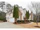 Elegant two-story home boasting a brick and stone facade, a spacious driveway, and meticulously landscaped grounds at 1360 Mount Mickinley Dr, Grayson, GA 30017