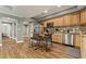 Kitchen boasts stainless steel appliances, an island with seating, and ample cabinet space for storage at 1360 Mount Mickinley Dr, Grayson, GA 30017