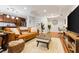 Living room featuring hardwood floors, recessed lighting, and a comfortable leather sofa at 1360 Mount Mickinley Dr, Grayson, GA 30017