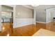 Elegant living room showcasing hardwood floors and decorative trim; glimpse into kitchen area at 1360 Mount Mickinley Dr, Grayson, GA 30017