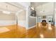 Open-concept living room featuring hardwood floors, a cozy fireplace, and abundant natural light at 1360 Mount Mickinley Dr, Grayson, GA 30017