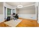 Bright home office with hardwood floors, modern lighting, and large windows offering natural light and decorative trim at 1360 Mount Mickinley Dr, Grayson, GA 30017