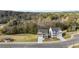 An aerial view of two homes, meticulously landscaped lawns, and a scenic tree line in the background at 1383 Van Allen Ct, Dacula, GA 30019