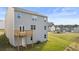The backyard offers a wooden deck, green lawn, and view of surrounding neighborhood at 1383 Van Allen Ct, Dacula, GA 30019