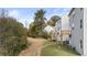 View of the backyard featuring two-story patios and lush foliage at 1383 Van Allen Ct, Dacula, GA 30019