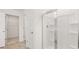 Modern bathroom with a glass-enclosed shower and easy access to a large walk-in closet at 1383 Van Allen Ct, Dacula, GA 30019