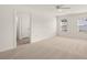 Bright bedroom with a ceiling fan and carpeted floors at 1383 Van Allen Ct, Dacula, GA 30019