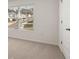 Bright bedroom with neutral carpet and a window providing natural light at 1383 Van Allen Ct, Dacula, GA 30019