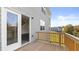 Spacious wooden deck with sliding glass doors leading to the home's interior at 1383 Van Allen Ct, Dacula, GA 30019