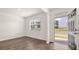 Well-lit living room featuring modern floors and an entry view at 1383 Van Allen Ct, Dacula, GA 30019