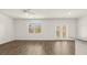 Open-concept living space with abundant natural light and stylish flooring at 1383 Van Allen Ct, Dacula, GA 30019