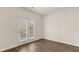 Bright living room with hardwood floors and double doors to a private patio at 1383 Van Allen Ct, Dacula, GA 30019