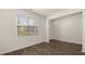 Bright living room with modern floors and a large window at 1383 Van Allen Ct, Dacula, GA 30019
